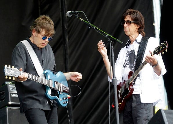 In this Aug. 7, 2001, photo, The Cars lead singer Ric Ocasek, right, and guitarist Elliot Easton perform during the Lollapalooza music festival at Grant Park in Chicago. Boston-based The Cars, who combined New Wave and classic rock sounds, will be inducted to the Rock and Roll Hall of Fame Saturday in Cleveland. [AP Photo, file / Nam Y. Huh]
