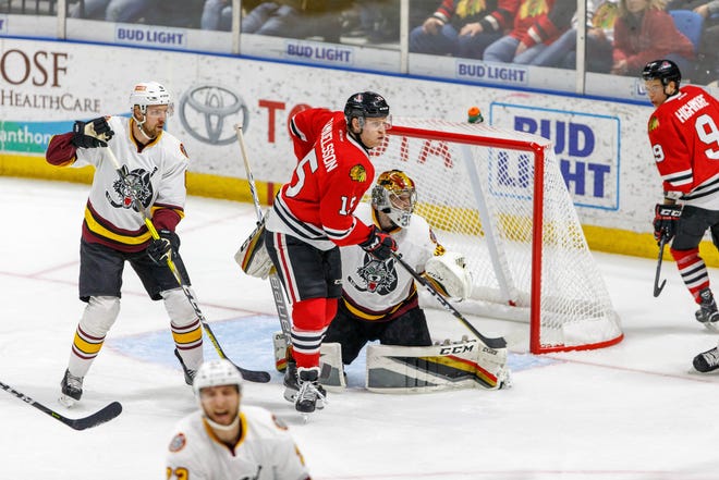 Rockford's Henrik Samuelsson awaits a pass deep in Chicago's zone during the two teams' matchup Friday at the BMO Harris Bank Center in Rockford. [ICEHOGS PHOTO]