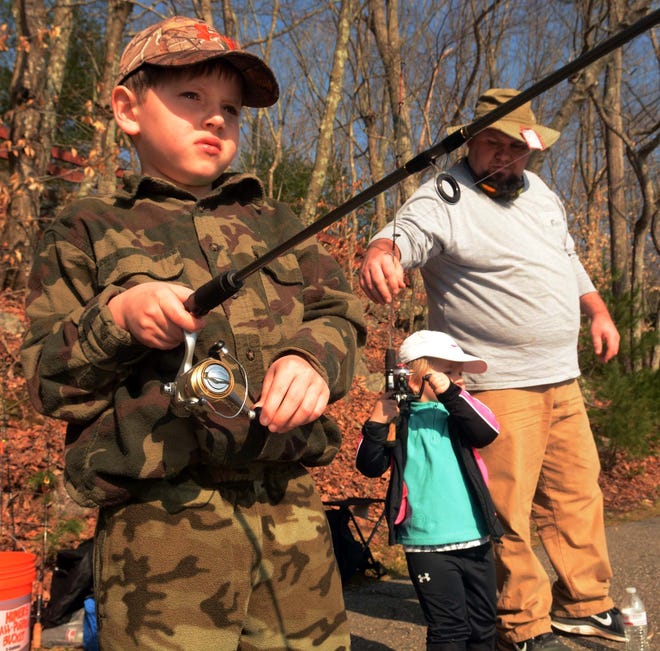 Ethan Mondor, of Norwich, fishes with his children Logan, 8, and Madisynn, 2, at Spaulding Pond Saturday on opening day of fishing. [John Shishmanian/ NorwichBulletin.com]