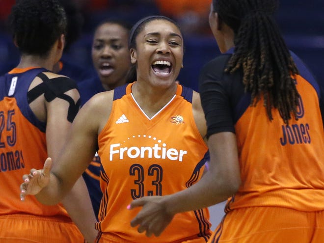 Connecticut Sun forward Morgan Tuck (33) smiles as she celebrates with Jonquel Jones, right, after the Sun defeated the Chicago Sky 94-89 in a WNBA basketball game Friday, July 22, 2016, in Rosemont, Ill. (AP Photo/Nam Y. Huh)