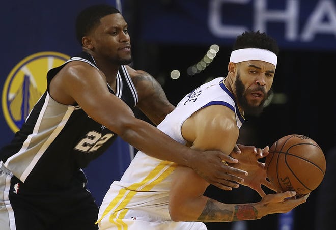 San Antonio Spurs' Rudy Gay (22) defends against Golden State Warriors' JaVale McGee during iGame 1 of a first-round NBA basketball playoff series Saturday, in Oakland, Calif. The Warriors won, 113-92. [The Associated Press]
