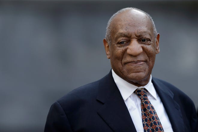 Bill Cosby smiles as he departs his sexual assault trial Friday at the Montgomery County Courthouse in Norristown. [MATT SLOCUM / THE ASSOCIATED PRESS]