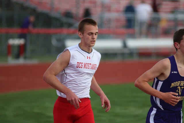 Jacob Waymire, shown running in a meet last season, placed third in the 1600 meter run at the Grinnell College indoor meet on Mar. 9. DCN FILE PHOTO