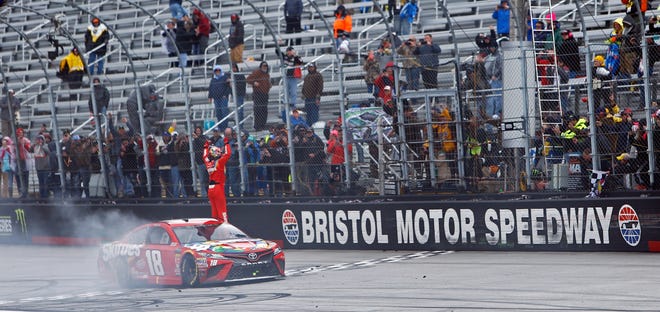 Kyle Busch celebrates after winning during a NASCAR Cup Series race Monday in Bristol, Tenn. [AP Photo/Wade Payne]