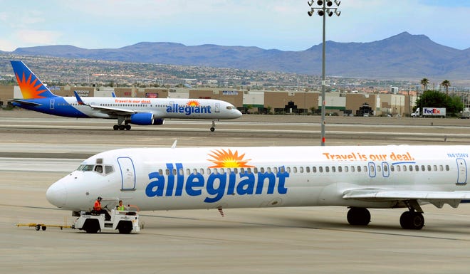 Allegiant Air jets taxi at McCarran International Airport in Paradise, Nevada, in 2013. A day after "60 Minutes" broadcast a report questioning Allegiant Air’s safety record, the budget carrier reacted, its parent company Allegiant Travel Company's shares lost about 3 percent of their value and U.S. Sen. Bill Nelson, a Florida Democrat, called for more congressional scrutiny of the the company and how the Federal Aviation Administration is overseeing its problems. [AP file/David Becker]