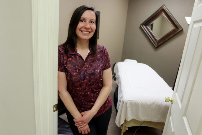 Emily Oleson, a massage therapist and independent contractor at Advanced Chiropractic, shown April 6 at her massage suite in Burlington. [John Lovretta/thehawkeye.com]