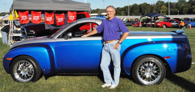 Dave Mareck poses with his one-of-a-kind 2006 Chevrolet SSR pickup/convertible. [Greg Zyla and Ronald Evans]