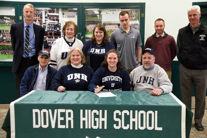 Dover High School senior Sarah Williams, seated second from right, signed her National Letter of Intent last week to attend the University of New Hampshire and compete on the track and field team on partial scholarship. Also seated, from left, are Williams’ grandfather Ted Waterman, mother Tammy Williams and father Russ Williams. Standing in the back, from left, are principal Peter Driscoll, grandmother Pam Waterman, sister Kristen Williams, brother Michael Williams, coach Nick Piatti and athletic director Peter Wotton. [John Huff/Fosters.com]