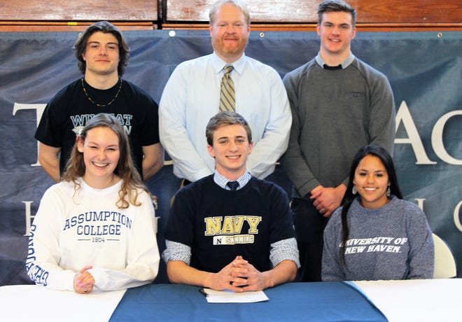 Five St. Thomas Aquinas High School seniors recently singed a National Letters of Intent to continue their athletic careers in college. In the front, from left, are Payton Hodsdon (volleyball, Assumption College), Brendan Sullivan (swimming, U.S. Naval Academy) and Meredith Karsonovich (lacrosse, New Haven). Standing in the back, from left, are Tim Bouchard (football, UNH), STA athletic director Ryan Brown and Gavin Scoon (football, Gannon University). [Courtesy]