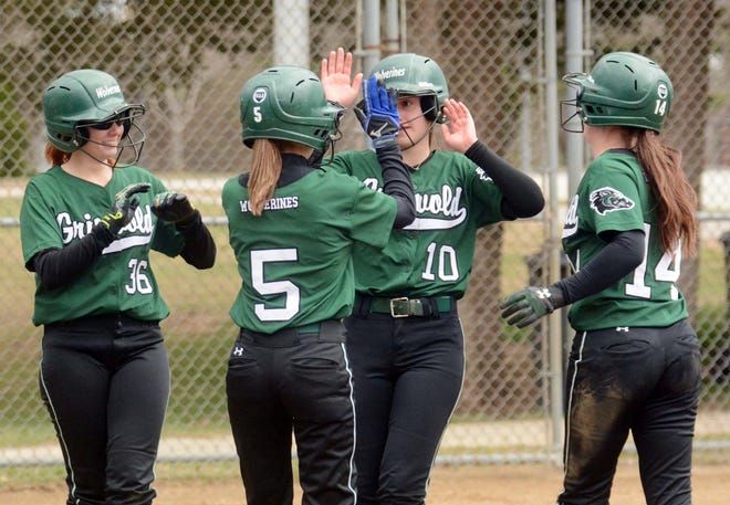 Griswold's Madison LaBoissiere, second from right, scores on an error after driving in three runs with a triple against St. Bernard Tuesday during their game in Griswold. [John Shishmanian/ NorwichBulletin.com]
