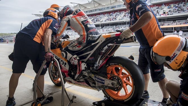 MotoGP rider Dani Pedrosa prepares to head out of his pit during a qualifying session last year at Grand Prix of the Americas. After the event, Pedrosa complained about bumps on the track, saying one section of the circuit reminded him of a “motocross” track.
