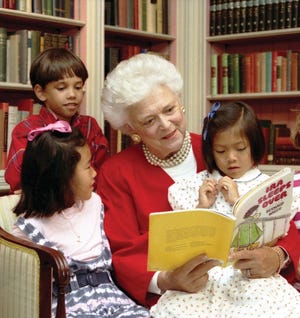 Barbara Bush reads to children in the White House Library in July 1990. [Photo provided by George Bush Presidential Library and Museum]