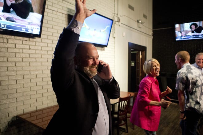 Geoff McConnell celebrates his victory in the Panama City Beach Ward 3 Commissioner race after seeing 100% of the votes counted at Fishale Taphouse and Grill on Tuesday. [JOSHUA BOUCHER/THE NEWS HERALD]