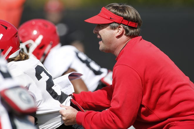 Georgia coach Kirby Smart gets hands on at a football practice earlier in the spring. (Photo/Joshua L. Jones, Athens Banner-Herald)