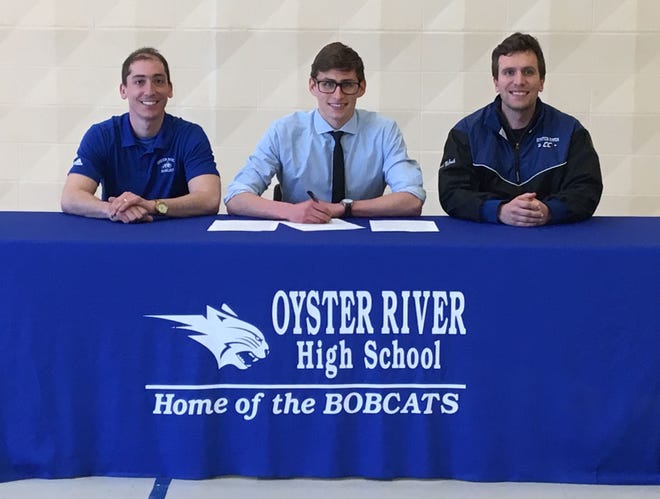Oyster River High School senior Kieran Murphy, center, recently signed his National Letter of Intent to attend Southern New Hampshire University to run cross country. He is pictured with coaches Nick Ricciardi, left, and Scott McGrath. [Courtesy]