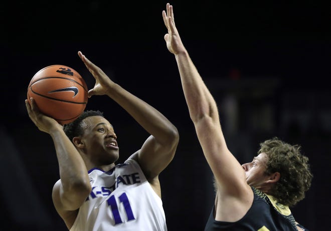 Kansas State guard Brian Patrick, left, announced Thursday his intention to transfer out of the program. Patrick averaged 1.6 points and 0.6 rebounds this past season and saw his playing time diminish as the season progressed. [File photograph/The Associated Press]