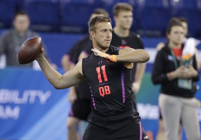 Richmond quarterback Kyle Lauletta throws during a drill at the NFL football scouting combine in March.