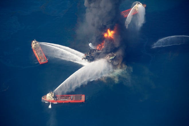 In this April 21, 2010, aerial file photo, the Deepwater Horizon oil rig burns in the Gulf of Mexico. U.S. Rep. Vern Buchanan, R-Longboat Key, is criticizing efforts by President Donald Trump's administration to rollback oil drilling regulations adopted after the disaster. [AP Photo Gerald Herbert]