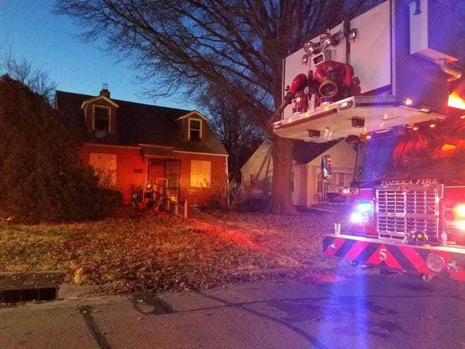 Topeka fire crews quickly contained a blaze early Friday morning in what's believed to be an abandoned house at 2000 S.W. Atwood, one block east of S.W. Gage. [Angela Deines/The Capital-Journal]