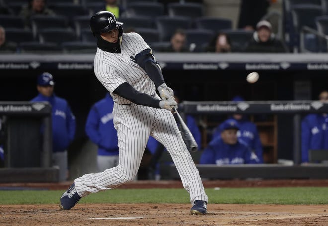 Yankees' Giancarlo Stanton connects for a two-run home run off Toronto Blue Jays starter Marco Estrada in the third inning of Friday night's game at the Stadium. The homer was Stanton's fourth of the season. [The Associated Press]