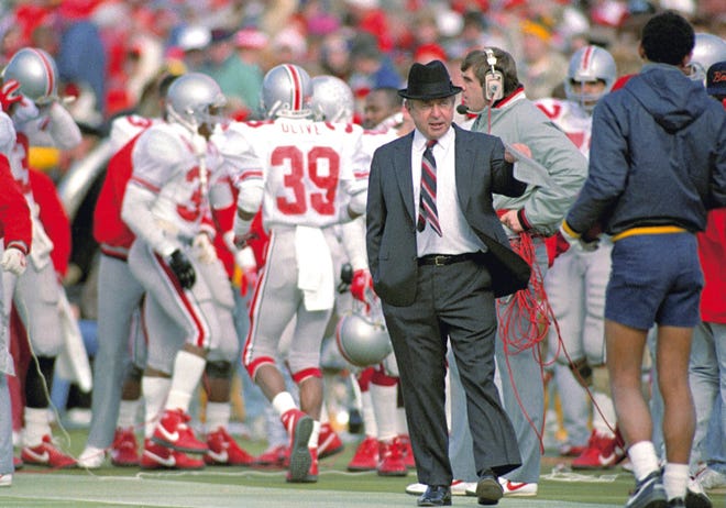 Ohio State head football coach Earle Bruce gestures on the sidelines during a game against Michigan in Ann Arbor, Mich., on November 21, 1987. Bruce died in Columbus, Ohio at the age of 87, according to a statement released by his daughters through Ohio State on Friday. He'd been suffering from Alzheimer's disease. (AP Photo/Robert Kozloff, File)