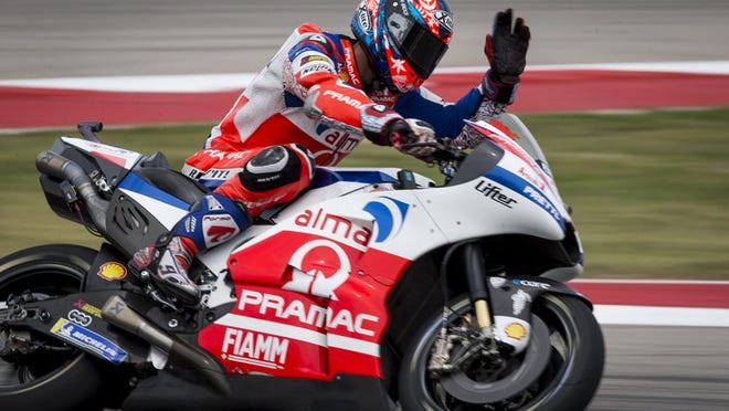 MotoGP rider Danilo Petrucci of Italy waves to fans Friday during a practice session at Circuit of the Americas. Qualifying will take place Saturday. NICK WAGNER / AMERICAN-STATESMAN