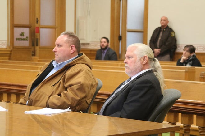 Dean Stauffer (left) and his attorney Bruce Lincoln listen to a statement by the victim's mother at Stauffer's Circuit Court sentencing in February. [SENTINEL-STANDARD FILE PHOTO]