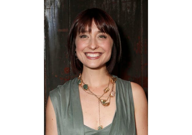This 2012 file photo shows television actress Allison Mack at a party in Los Angeles. Federal prosecutors say television actress Allison Mack, from "Smallville" has been charged with sex trafficking for helping recruit women to be slaves of a man who sold himself as a self-improvement guru.