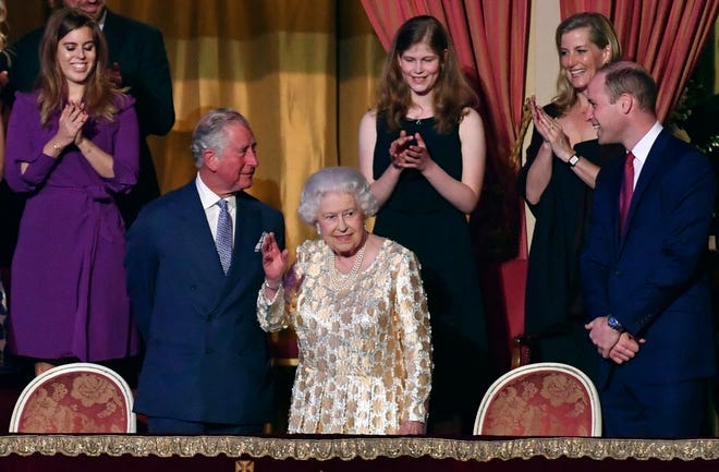 Britain's Queen Elizabeth II, surrounded by members of the royal family, takes her seat at the Royal Albert Hall in London on Saturday April 21, 2018, for a concert to celebrate the 92nd birthday of Queen Elizabeth II. (John Stillwell/Pool via AP)