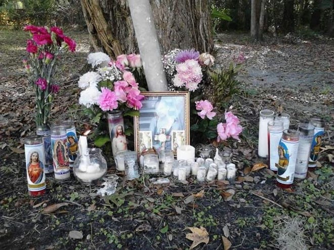 Candles and flowers mark an impromptu memorial site set up by friends after the murder of Jillian Barrios. (Provided by Beatrize Mejias)