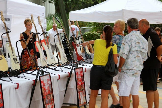Guitars signed by well-known performers will be auctioned off during the Friends of St Augustine Amphitheatre (FOSAA) raffle and silent auction May 22 at the St. Augustine Amphitheatre. The event will start at 6 p.m., and winners will be announced at 8 p.m. [Contributed Photo]