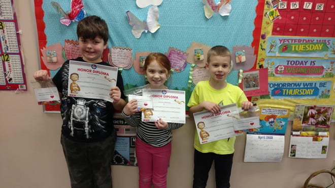 Second-graders at Open Bible Learning Center recently participated in the Pizza Hut Book It reading program. Pictured, from left: Harley Raih, Addison Rosenstein and Charlie Myers. [PHOTO PROVIDED]