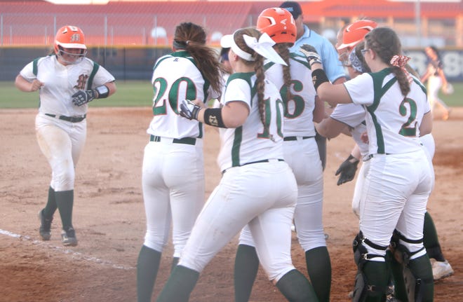 Mosley's Kassidy Hutchins is greeted by her teammates after hitting a two-run home run in the third inning of Monday's District 2-6A semifinal game at Arnold High School. [PATTI BLAKE/THE NEWS HERALD]