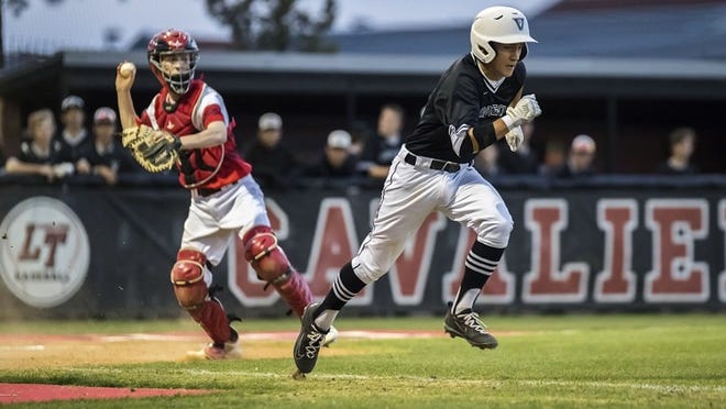April 20, 2018, Lakeway, TX; Vandegrift Vipers Drew Nelson (3) runs to first base on a third strike as Lake Travis Cavaliers Aidan Babinski (16) throws to first for the out during the second inning for District 6A baseball game at Lake Travis High School. JOHN GUTIERREZ / FOR AMERICAN-STATESMAN