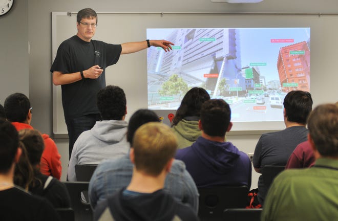 Brian "Bam" McClendon, of Kansas University, talks Tuesday morning to students at Central High School about careers in computer programming. [TOM DORSEY / SALINA JOURNAL]