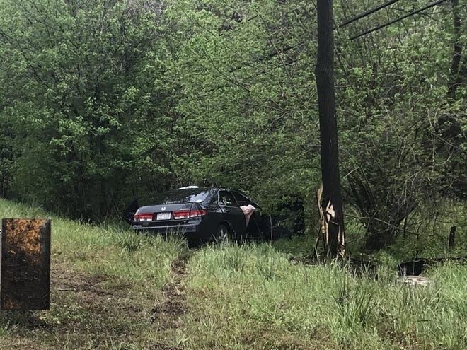 Two people narrowly missed going down a hill into a creek in a Tuesday afternoon wreck. [Joyce Orlando/The Star]