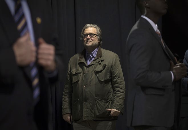Steve Bannon, then chief executive of Donald Trump’s presidential campaign, looks on Oct. 28, 2016, as Donald Trump speaks to supporters in Manchester, N.H. [Stephen Crowley / The New York Times]