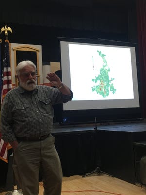Tom Worthley, an associate extension professor at UConn’s Cooperative Extension Service and the college’s Department of Natural Resources and the Environment, at the Danielson Veterans Coffeehouse on Tuesday speaking about gypsy moths. [John Penney/NorwichBulletin.com]