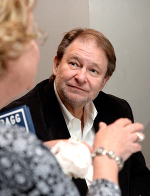Author Rick Bragg, right, talks with an attendee of his book signing, Thursday, Oct. 29, 2015, at the Hardin Center in Gadsden, Ala. (Gadsden Times, Marc Golden)