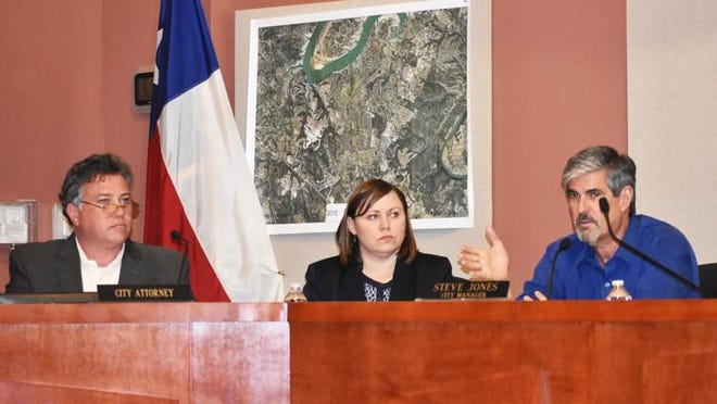 Lakeway City Attorney Alan Bojorquez (from left), associate attorney for the Borjorquez Law Firm Erin Selvera and City Manager Stev Jones discuss possible solutions to the city’s election issues during a council meeting Monday. LESLEE BASSMAN FOR LAKE TRAVIS VIEW