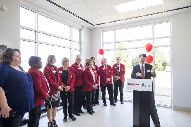 Stan Blaylock, right, president and CEO of Physicians Immediate Care, makes remarks as members of the Freeport Area Chamber of Commerce look on during a ribbon cutting and open house on Wednesday, April 25, 2018, at the new Physicians Immediate Care/FHN clinic in Freeport. [SCOTT P. YATES/THE JOURNAL-STANDARD STAFF]