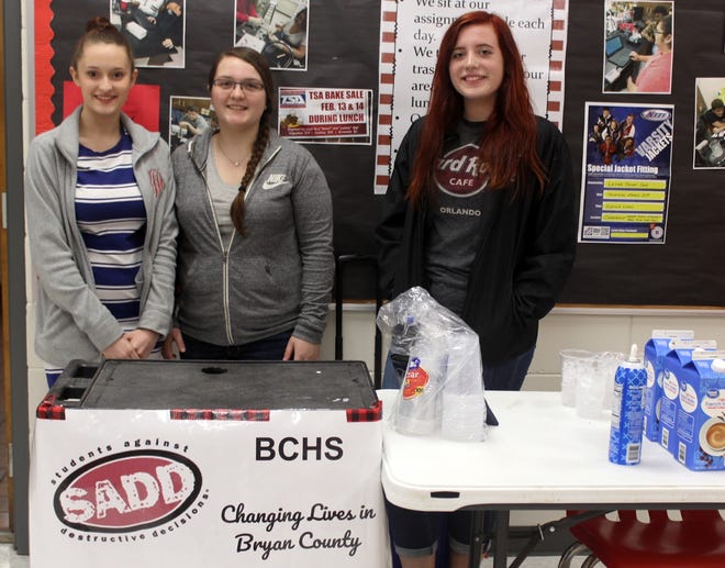 Bryan County High School SADD club members sell iced coffees during lunch to raise funds for the club. Pictured are: Adrienne Kennedy, treasurer (left), Julia Jackson, president and Jaylan Parker, secretary. [Diane Thomson/For Bryan County Now]