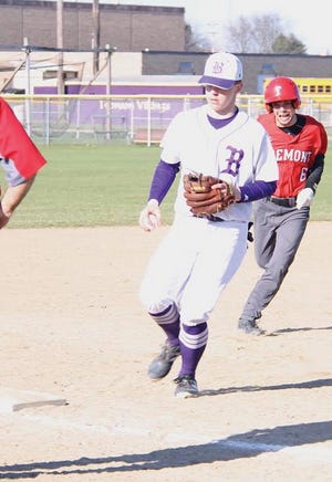 Bronson’s Brett Sikorski beats a Fremont runner to third base to record an out on Wednesday evening.