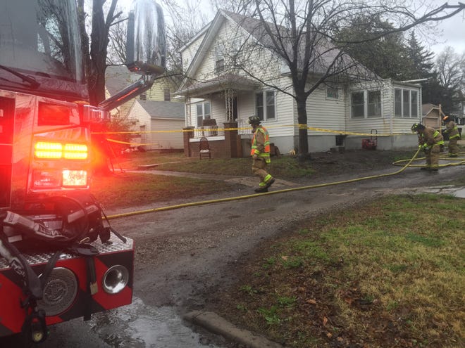 A blaze was reported at 1:04 p.m. Wednesday at a two-story residence at 1532 S.W. 16th. [Phil Anderson/The Capital-Journal]