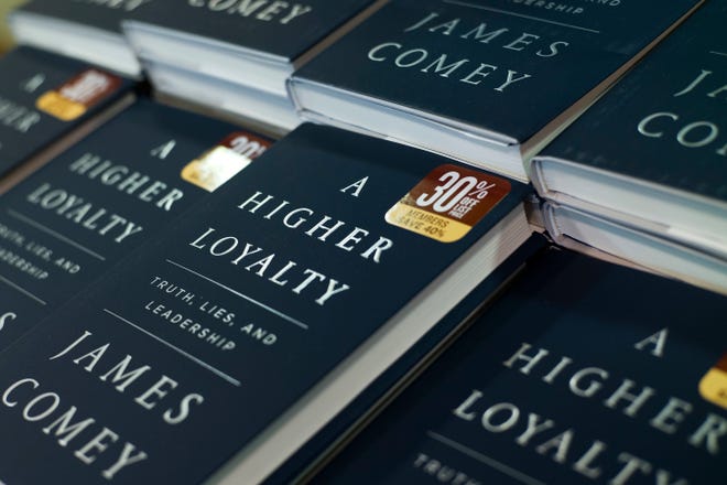 The book “A Higher Loyalty” by former FBI Director James Comey is displayed Tuesday at a Barnes & Noble bookstore in New York. [Mark Lennihan/AP]