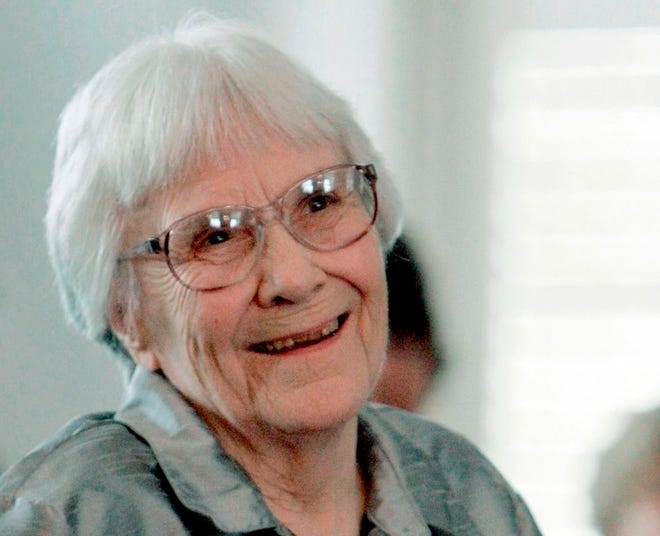 Author Harper Lee smiles during a ceremony honoring the four new members of the Alabama Academy of Honor at the Capitol in Montgomery on Aug. 20, 2007. [AP Photo/Rob Carr, File]