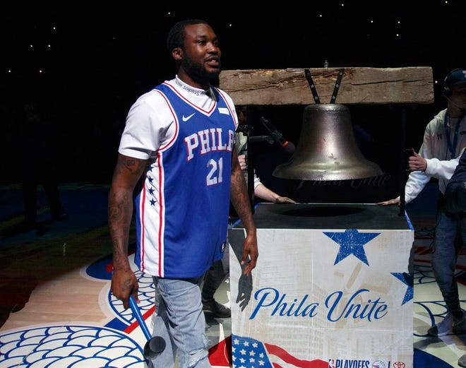 Rapper Meek Mill comes out to ring a Liberty Bell replica before the first half in Game 5 of a first-round NBA basketball playoff series between the Miami Heat and the Philadelphia 76ers, Tuesday, April 24, 2018, in Philadelphia. [AP Photo/Chris Szagola]
