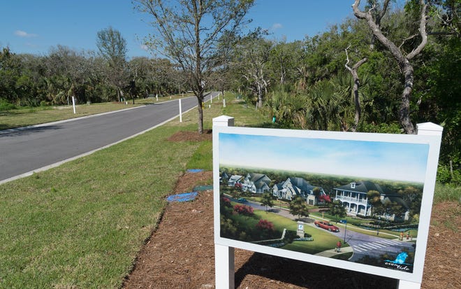 An artist's rendering on a sign shows the plans for the EvenTide development in Ponte Vedra Beach on Wednesday. [PETER WILLOTT/THE RECORD]
