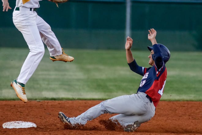 Hector Sanchez slides into second base as Pine Forest High School baseball hosts Terry Sanford on Wednesday. [Raul F. Rubiera/The Fayetteville Observer]