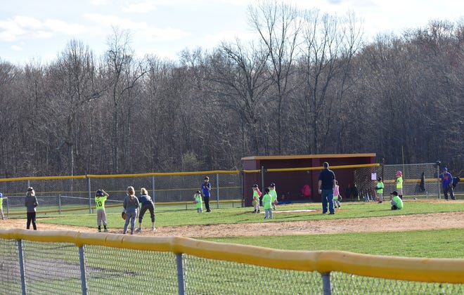 A Town of Wallkill Little League team plays a game at James J. Shannon Memorial Field on Thursday. Members of the league wants the Wallkill Town Board to add lighting to the grounds at 1 Little League Way so that games and practices can take place after dark. [Lana Bellamy/Times Herald-Record]
